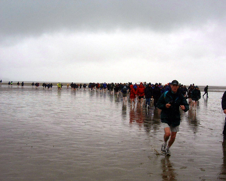 some 300 walkers on a Rotary Club event to raise cash for Polio Eradication are guided across the sands of Morecambe Bay by Cedric in June 2003