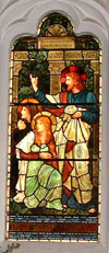 window in Grasmere church showing Pre-Raphelite art in cumbria